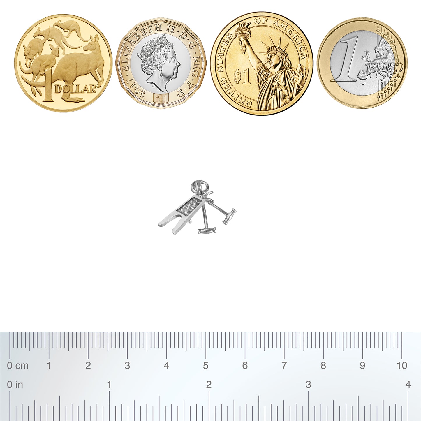 Silver boot jack and pulls charm with coins and ruler for scale