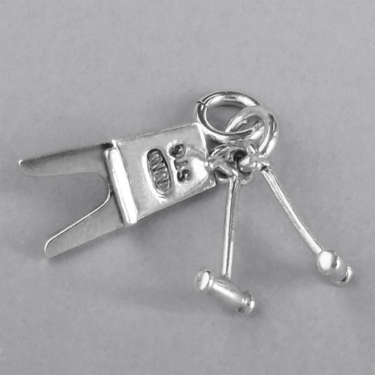 Boot Jack and Pulls Charm Sterling Silver on a grey background