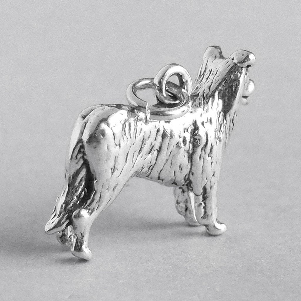 silver border collie dog charm on grey background