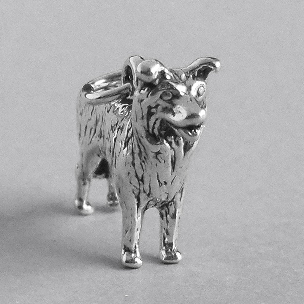silver border collie dog charm on grey background