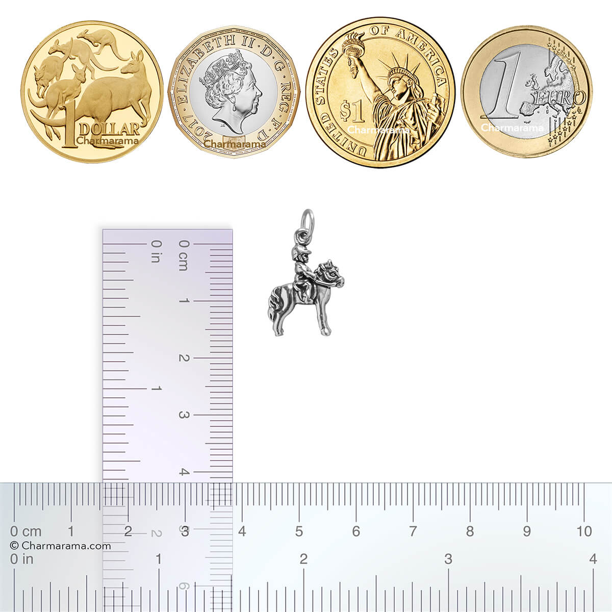 silver child on pony charm with coins and ruler for scale on white background