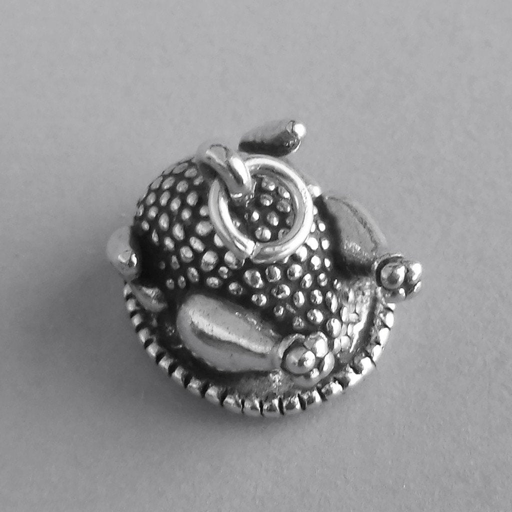 silver roast turkey charm on grey background