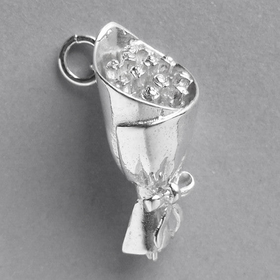 silver bouquet of roses charm on a grey background