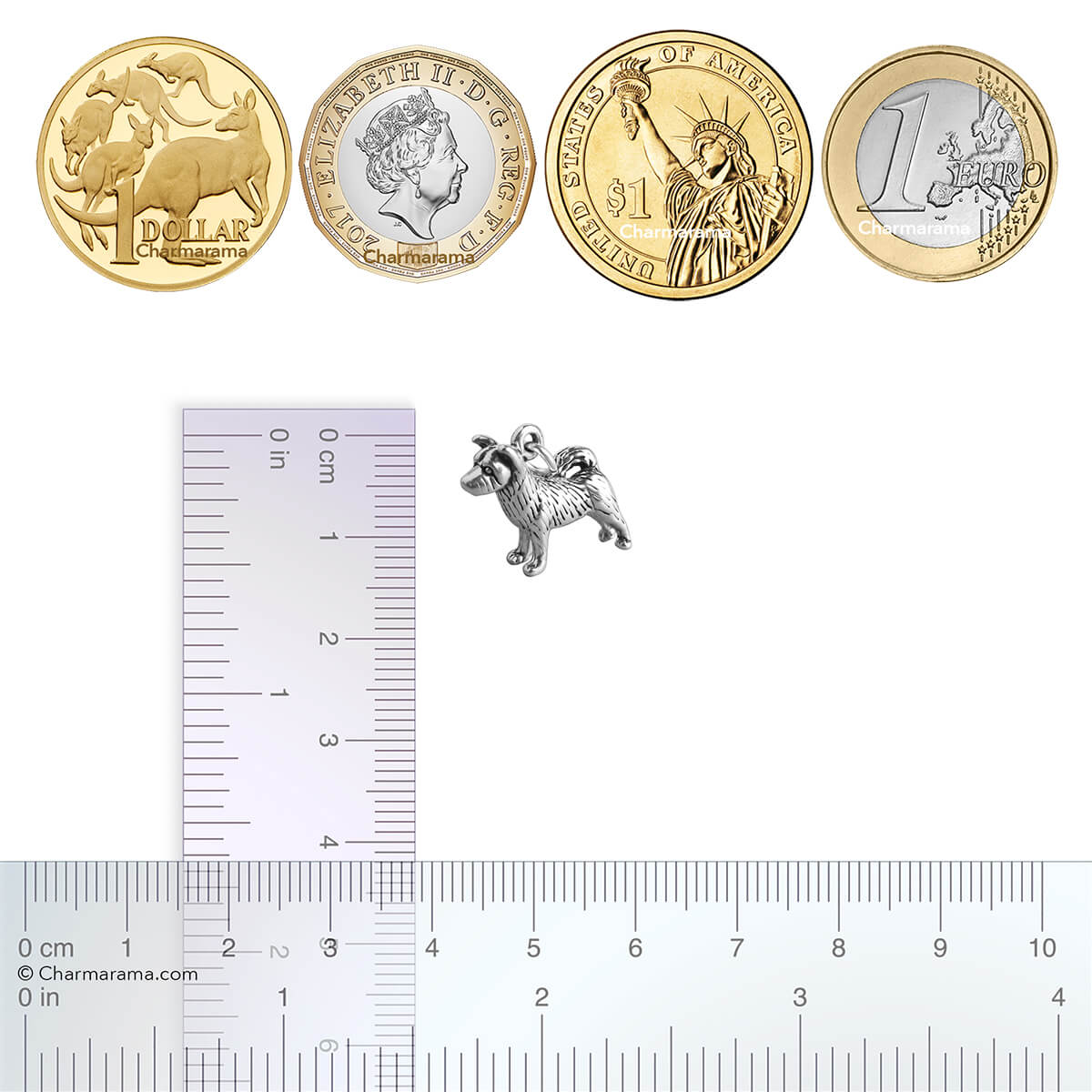 silver akita dog charm with coins and ruler for scale