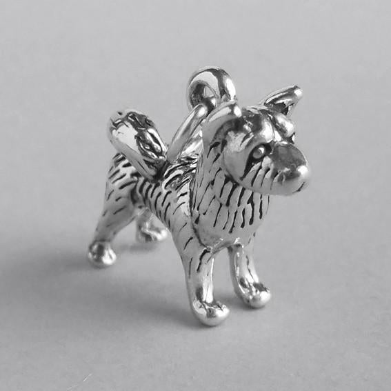 silver akita dog charm on grey background