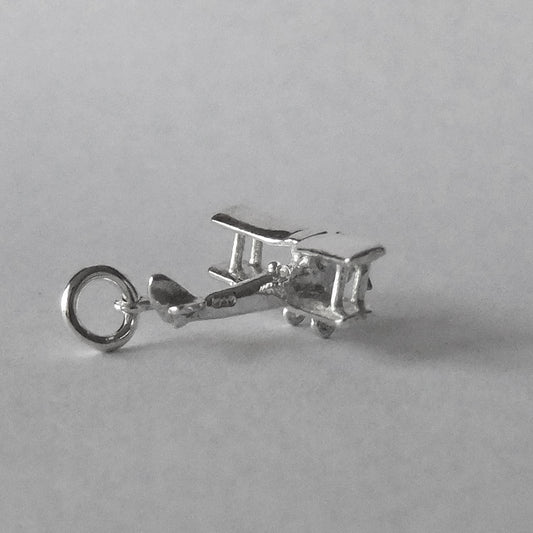 Tiger Moth aeroplane charm in sterling silver on a grey background