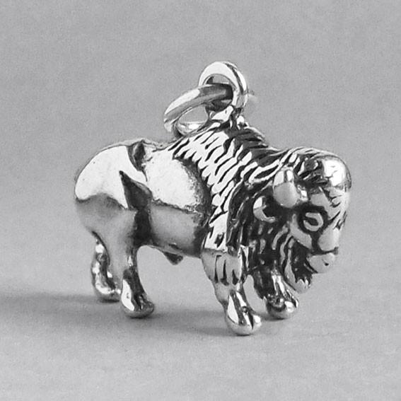 silver buffalo charm pictured from side on a grey background