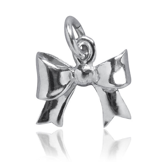 miniature silver bow charm on white background