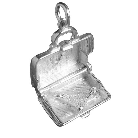 Sterling silver briefcase charm which opens to lingerie on a white background