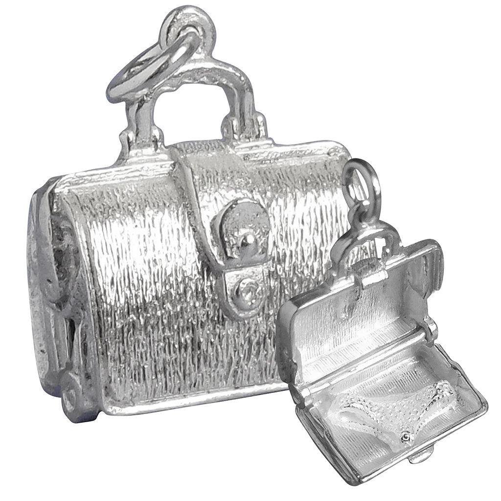 Sterling silver briefcase charm which opens to lingerie on a white background
