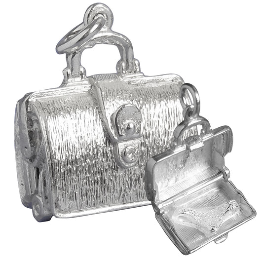 Sterling silver briefcase charm which opens to lingerie on a white background