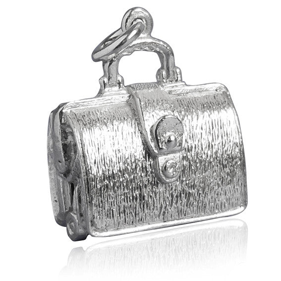Sterling silver briefcase charm which opens to lingerie on a white background