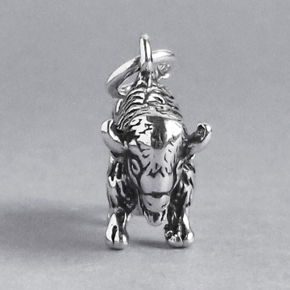 silver buffalo charm pictured from front on a grey background