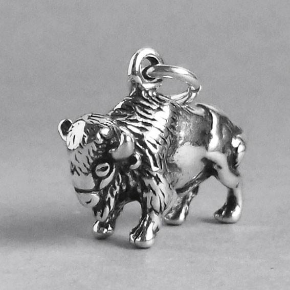 silver buffalo charm pictured from front on a grey background