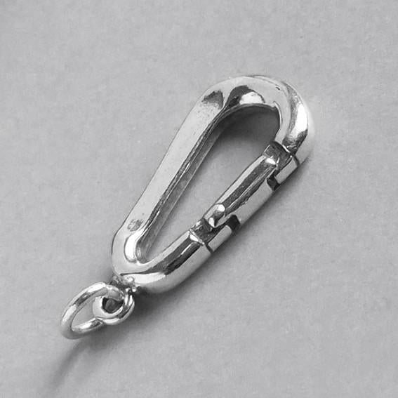 silver carabiner charm on grey background