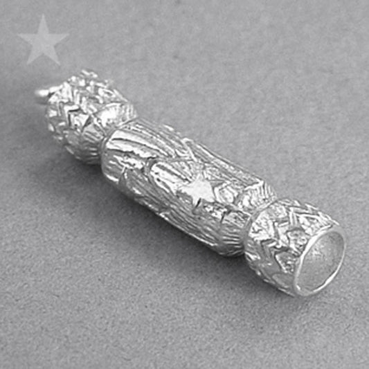 silver Christmas cracker charm on grey background