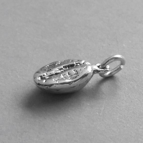 silver coffee bean charm side view on grey background