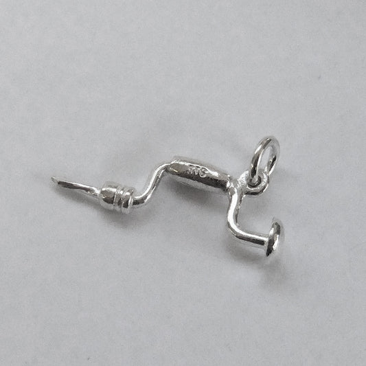 silver brace charm on a grey background