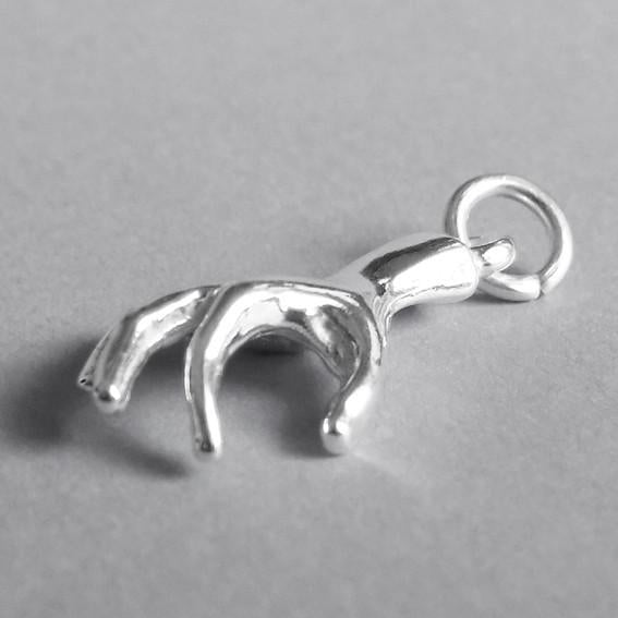 Sterling Silver Human Hand Charm side view on grey background