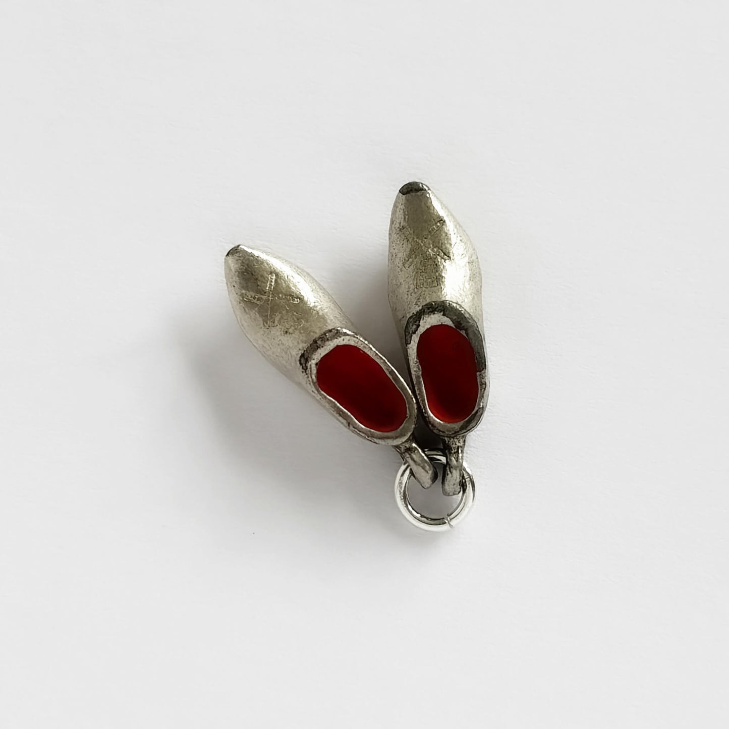 A vintage charm, pair of silver plated and red enamel Dutch clogs charm.