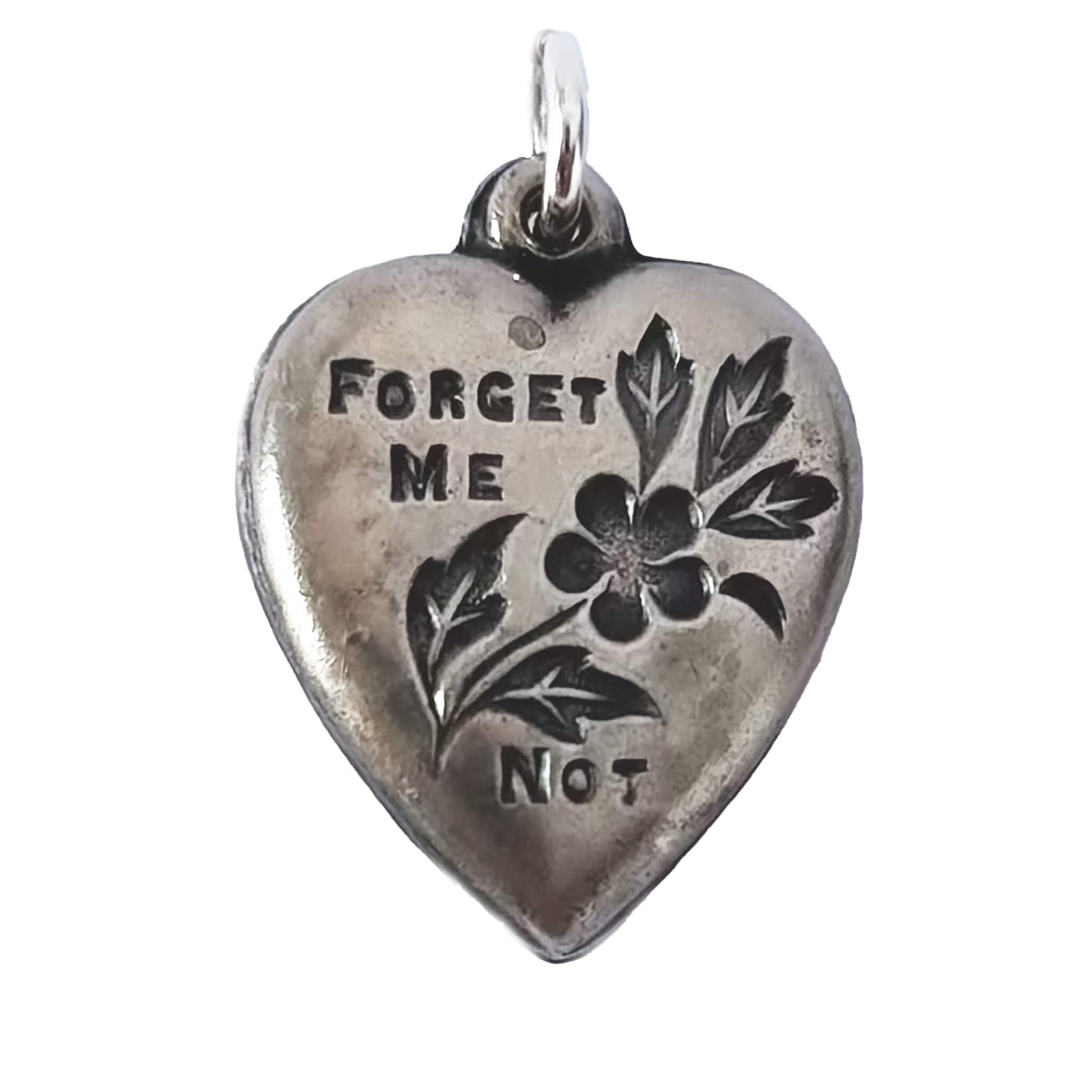 Silver heart-shaped pendant with 'Forget Me Not' engraving on a white background