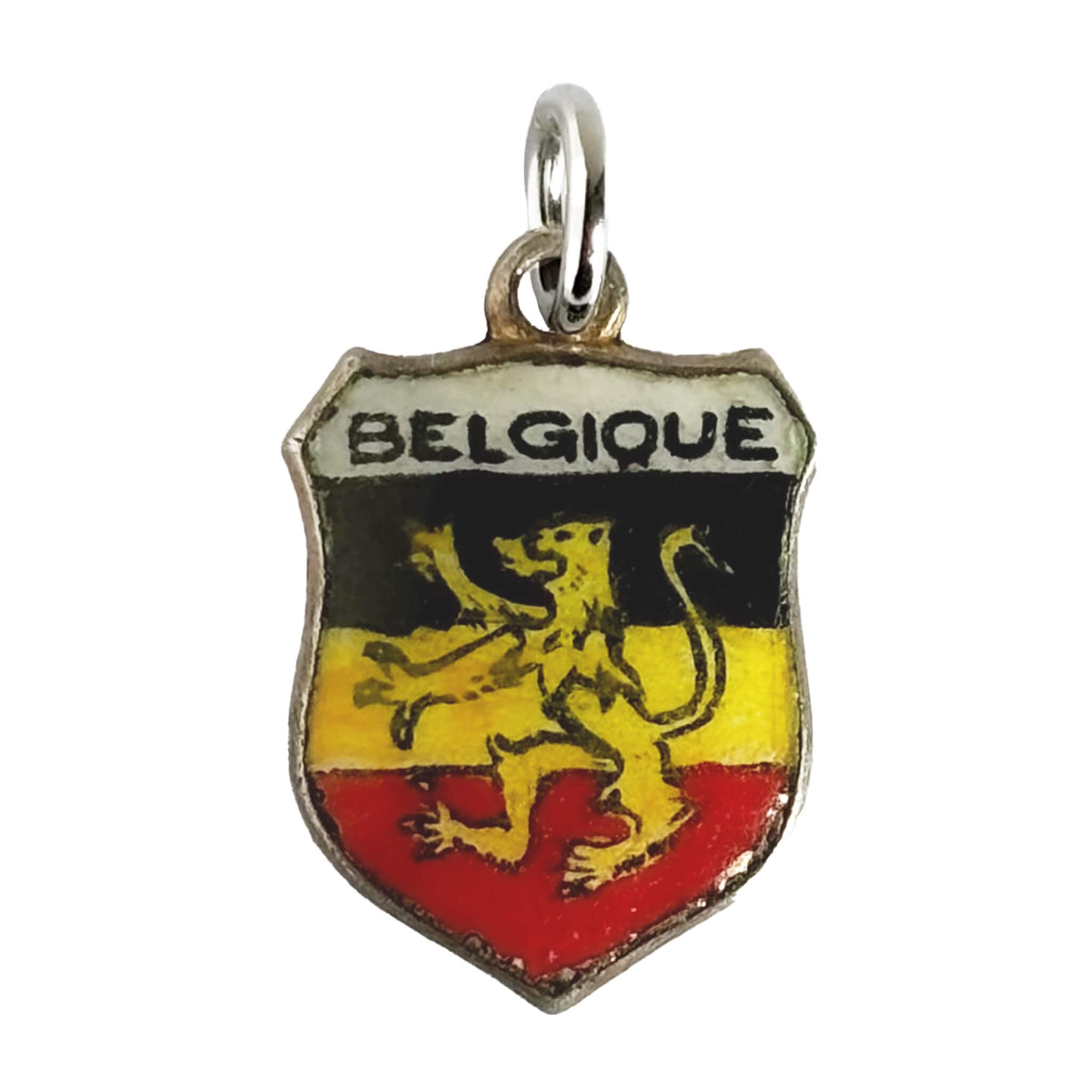 Vintage Belgium travel shield charm with black yellow and red enamel and rampant lion on white background.
