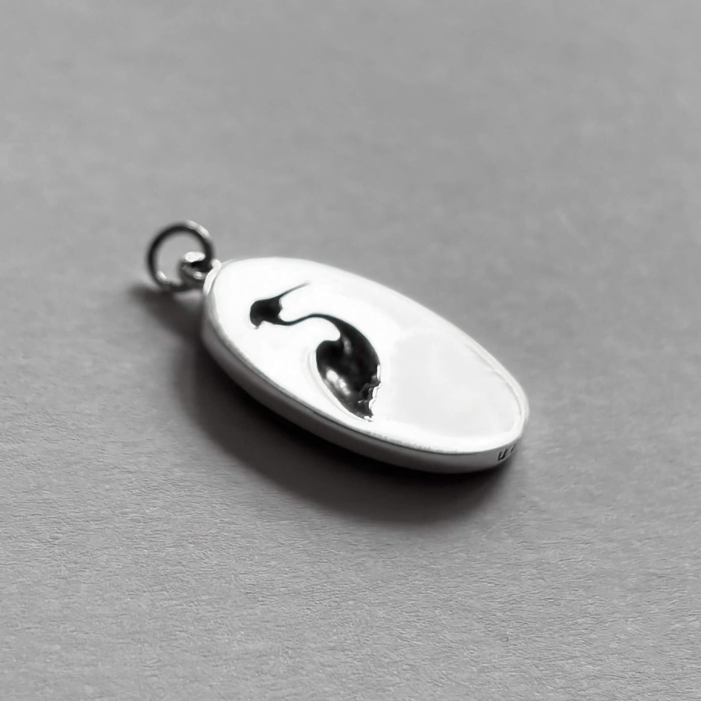 Back of sterling silver heron in oval frame charm bird pendant from Charmarama