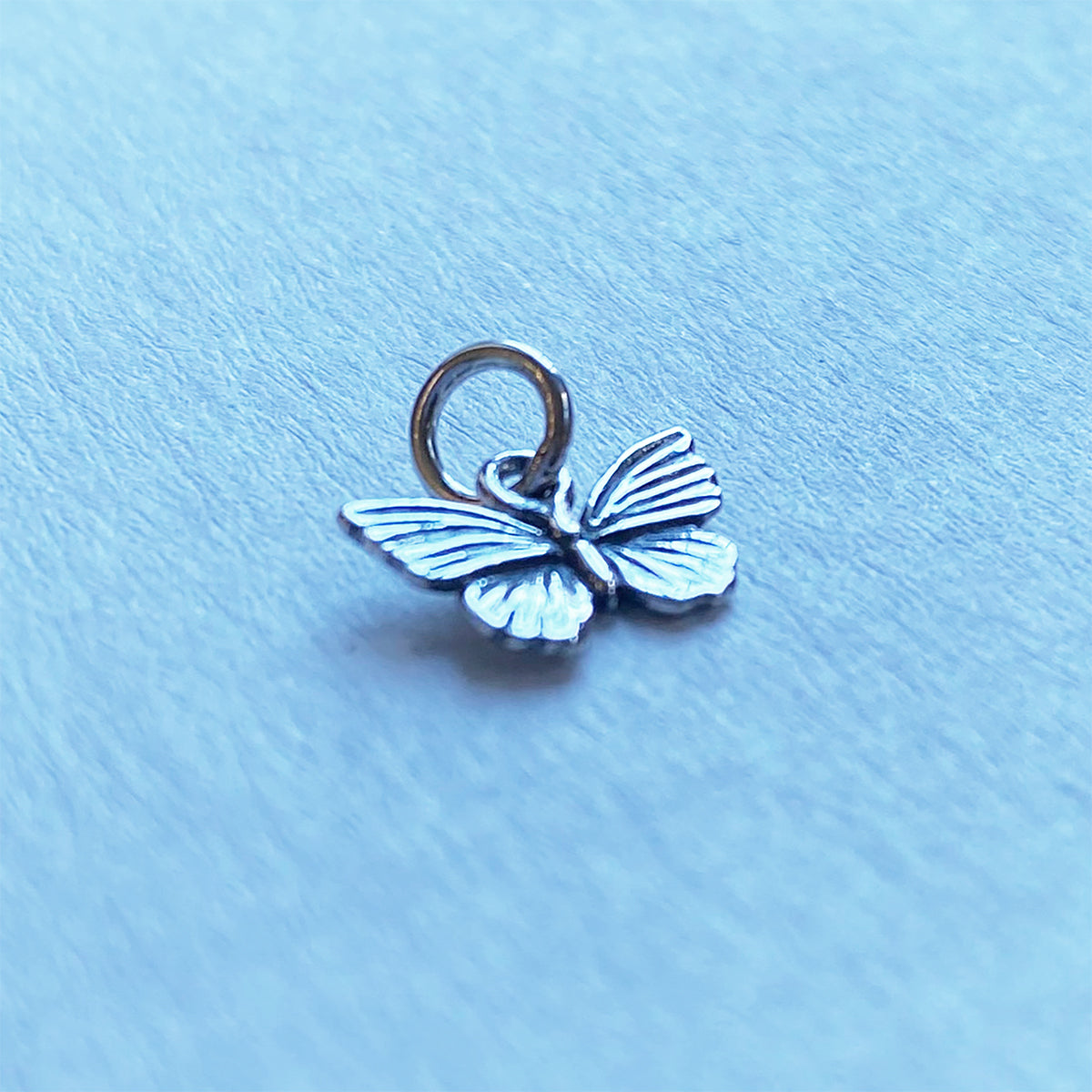 Small sterling silver butterfly charm at Charmarama