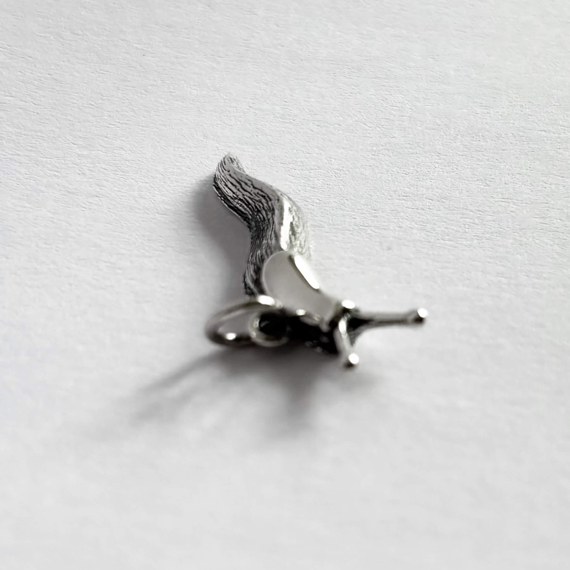 Sterling silver slug charm front view