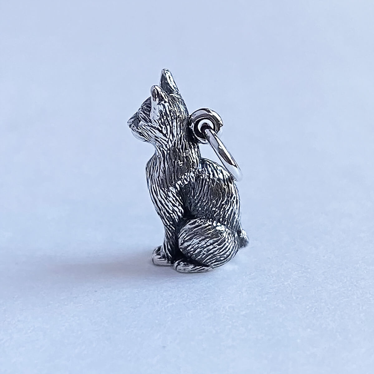 Intricately detailed sterling silver sitting cat charm from Charmarama charms