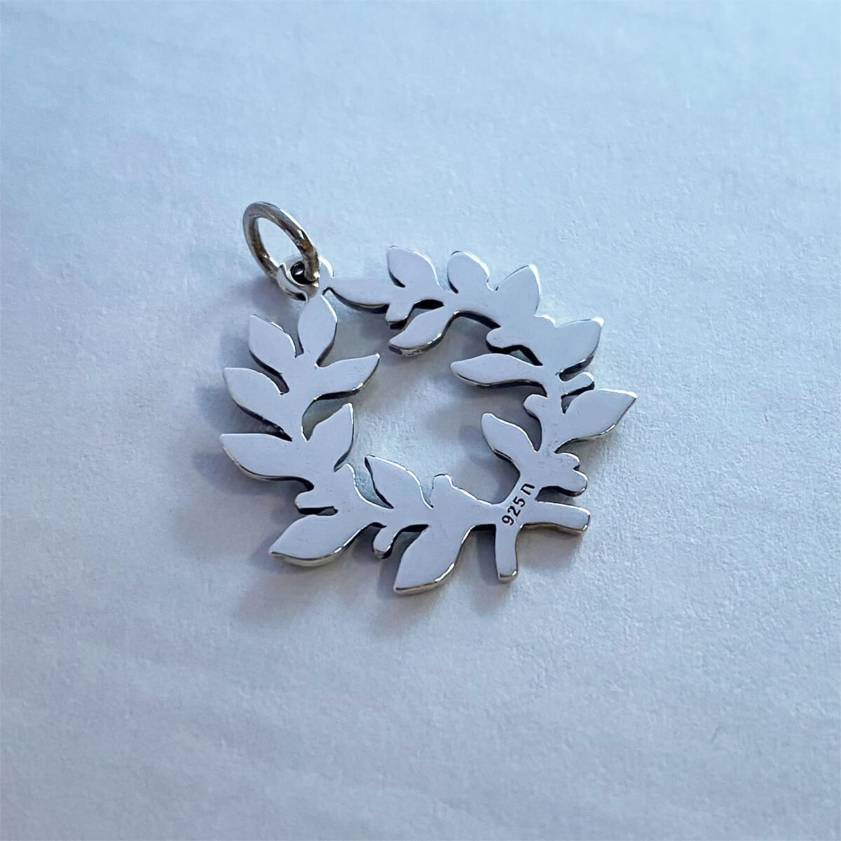 Sterling silver laurel wreath charm with polished reverse