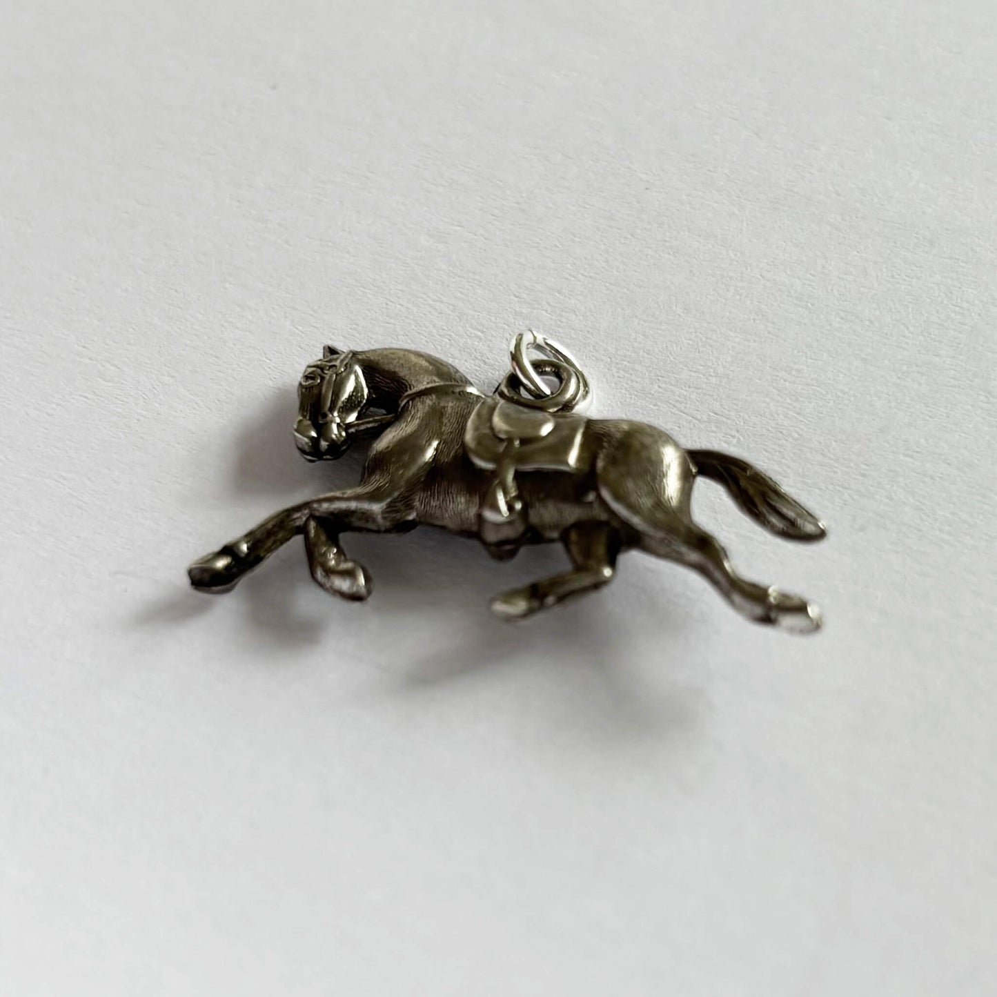 Silver vintage 3D horse trotting charm underside