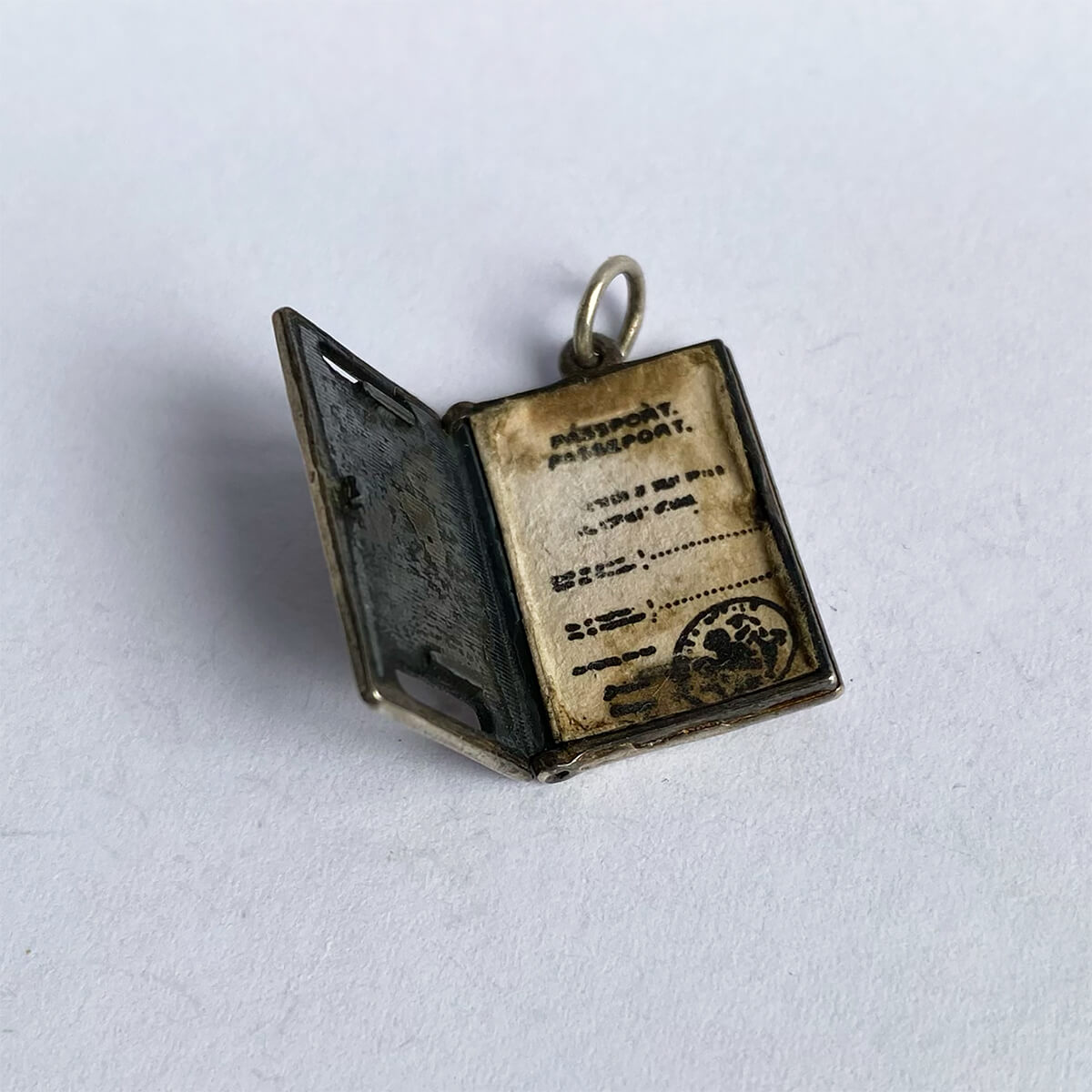 Vintage silver British Passport pendant opens to paper