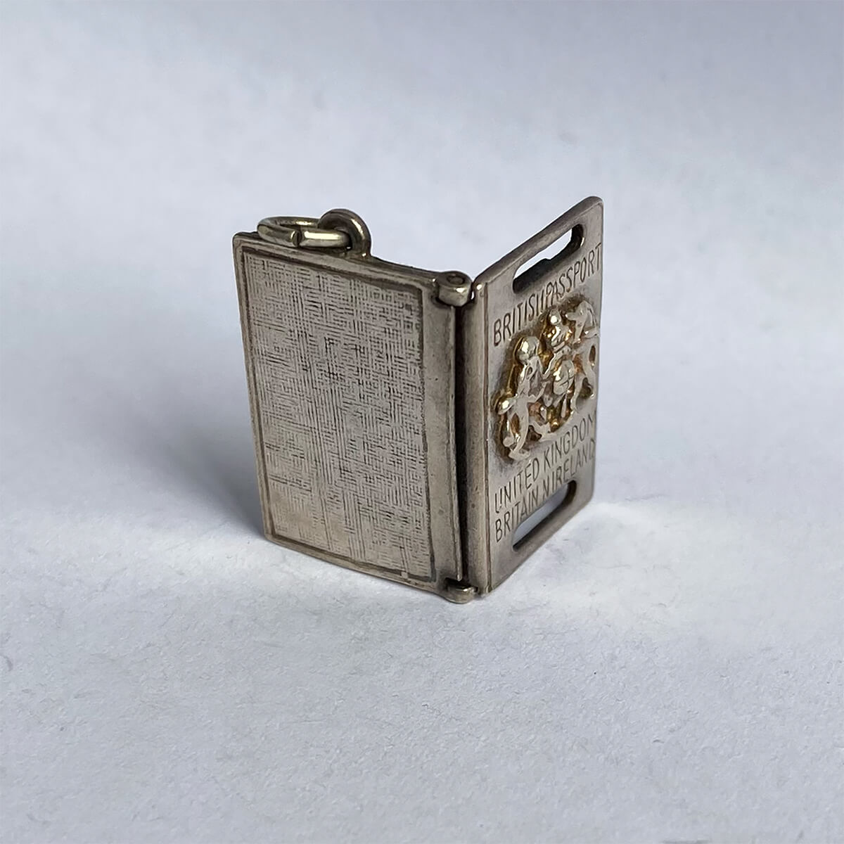 1970s silver British Passport charm opens to paper