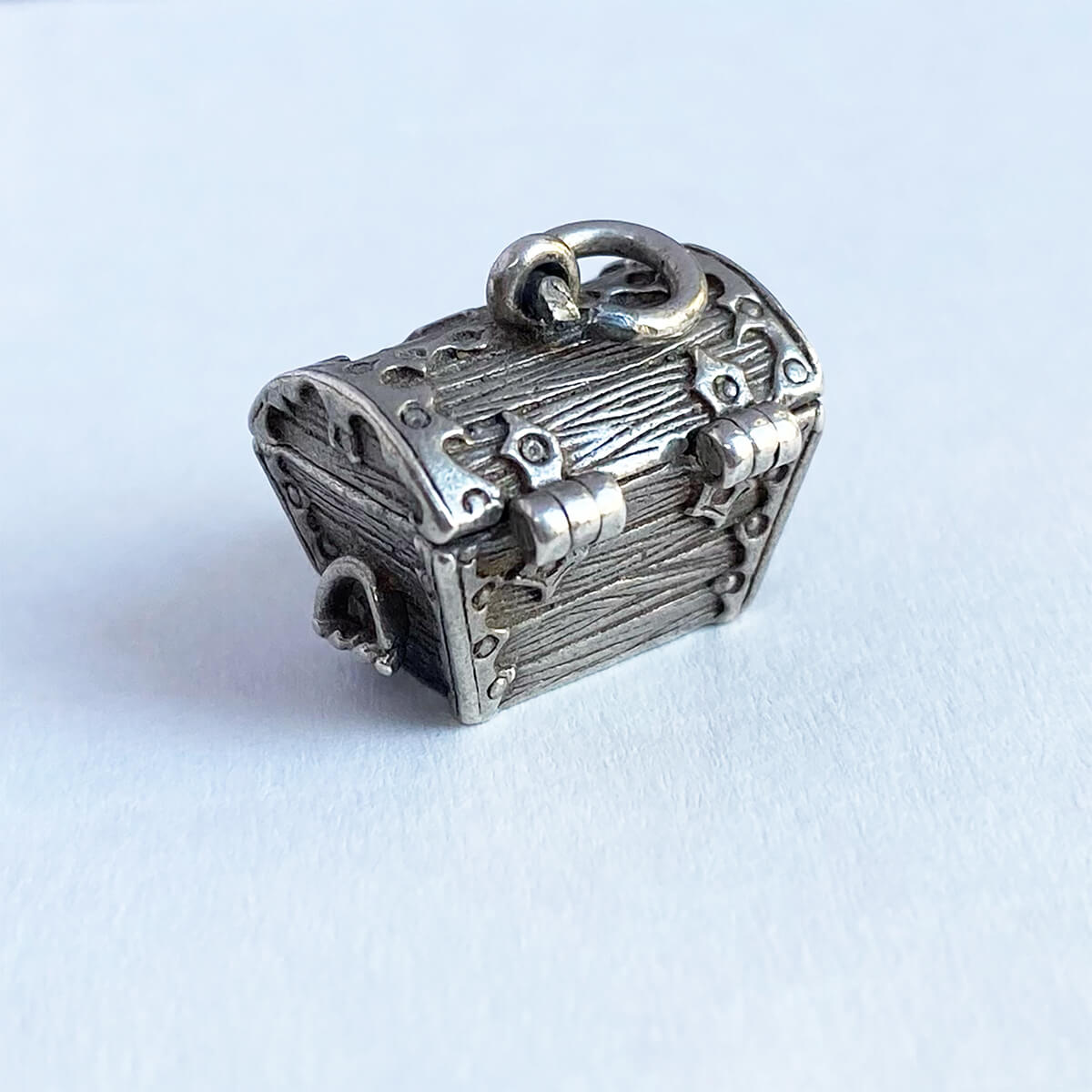Vintage silver treasure trove charm opens to loot