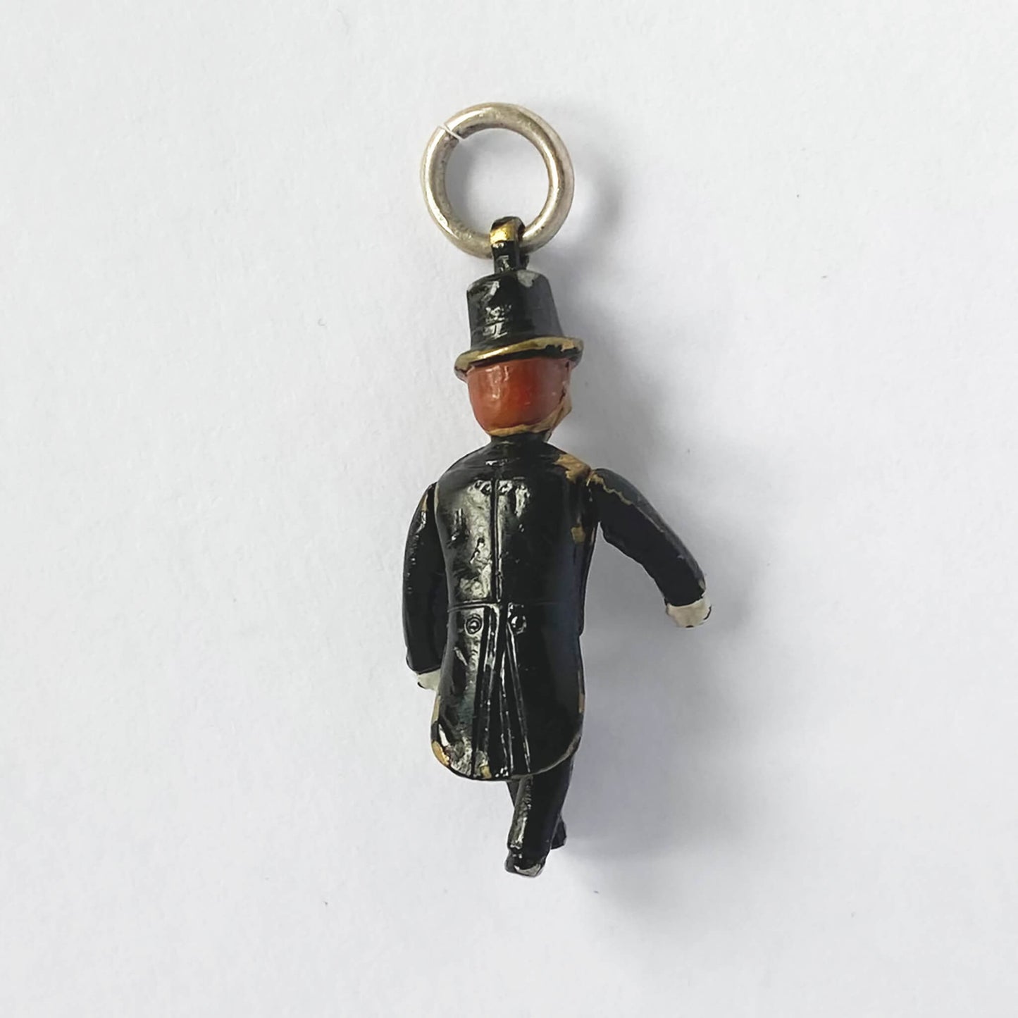 Charlie McCarthy ventriloquist dummy charm with enamel on a white background