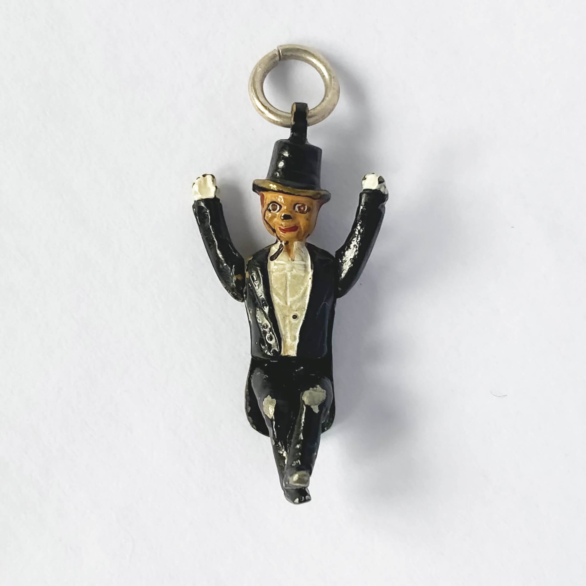 Charlie McCarthy ventriloquist dummy pendant with enamel on a white background