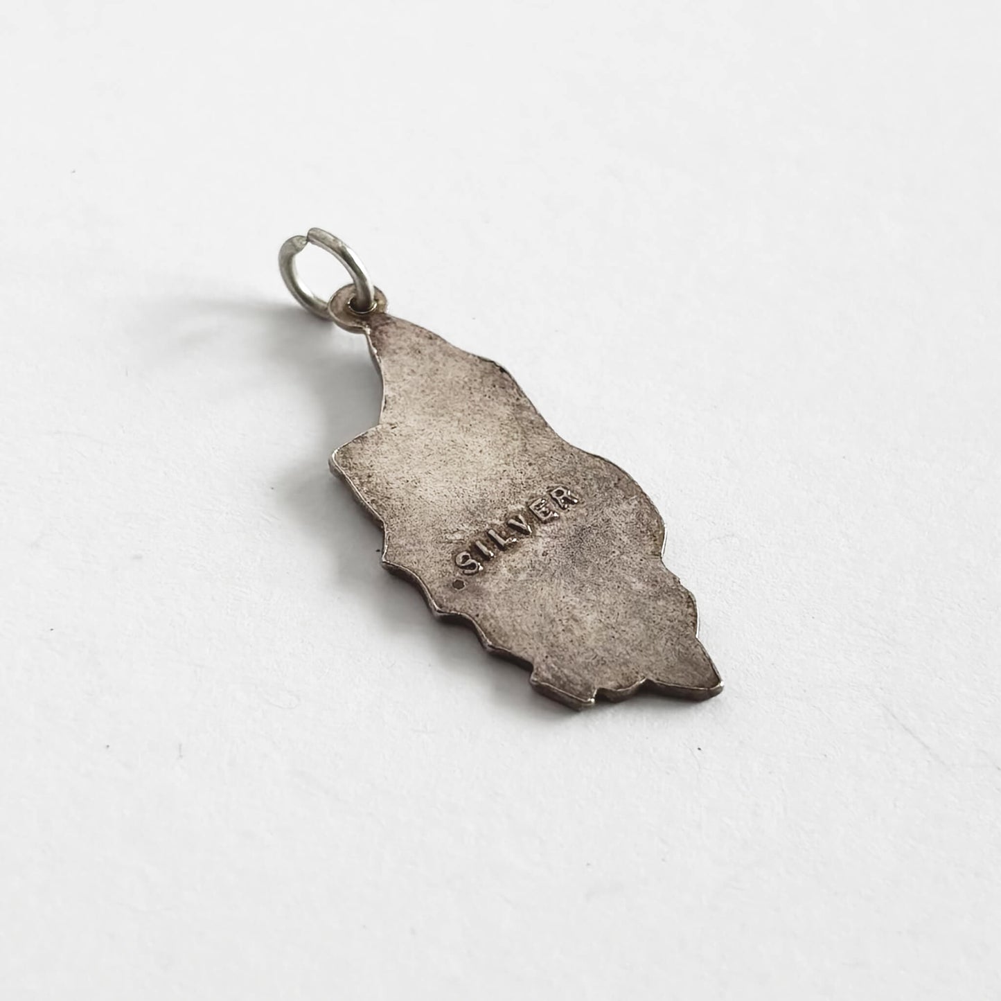 Silver Isle of Man charm with 'SILVER' engraving on the reverse
