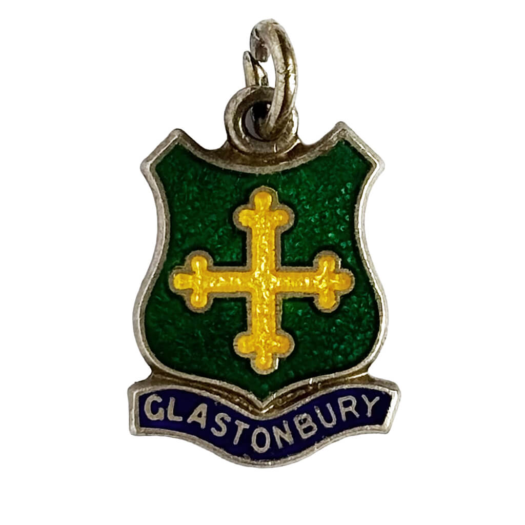 Vintage charm green and yellow pendant with 'Glastonbury' text on a white background