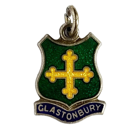 Vintage charm green and yellow pendant with 'Glastonbury' text on a white background