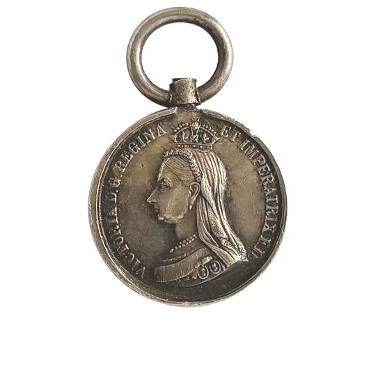 Coin fob pendant with profile of Queen Victoria wearing a crown on a white background