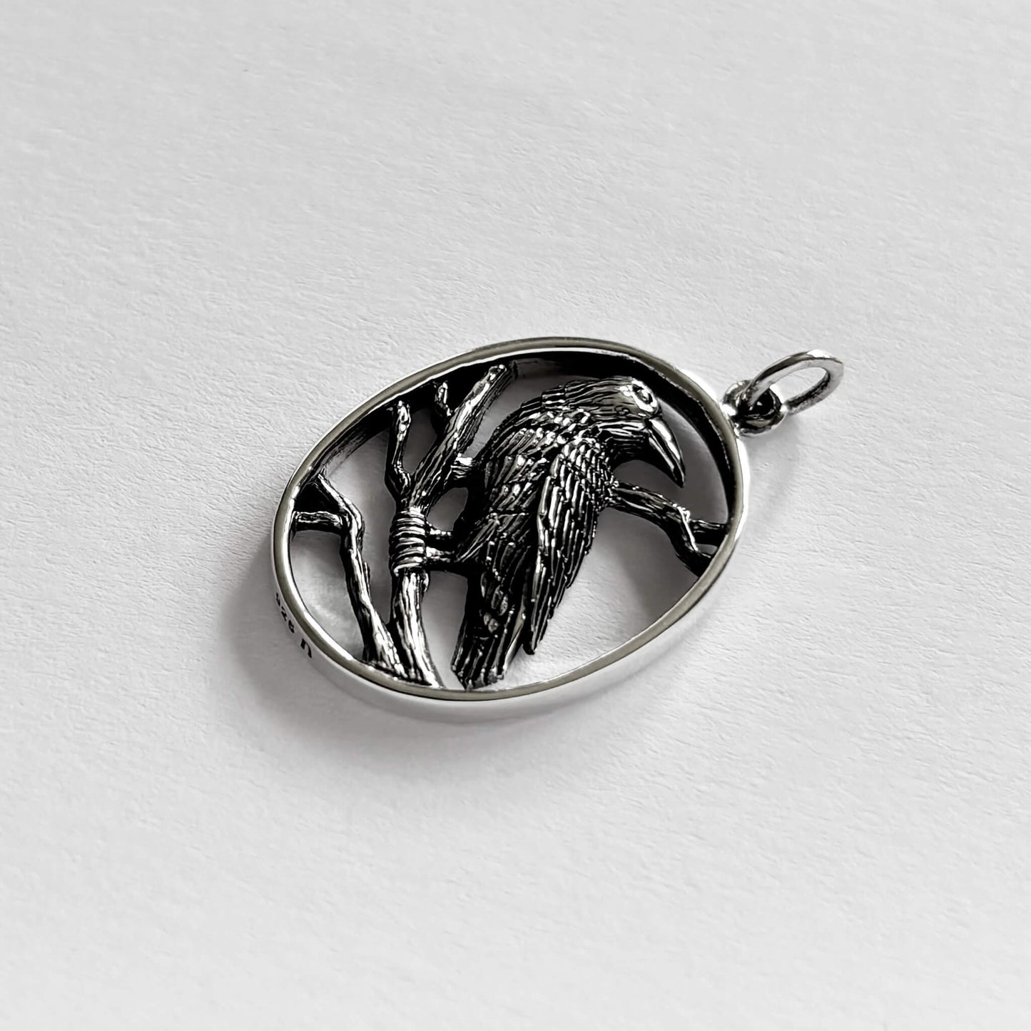 Rook in oval frame charm sterling silver bird pendant