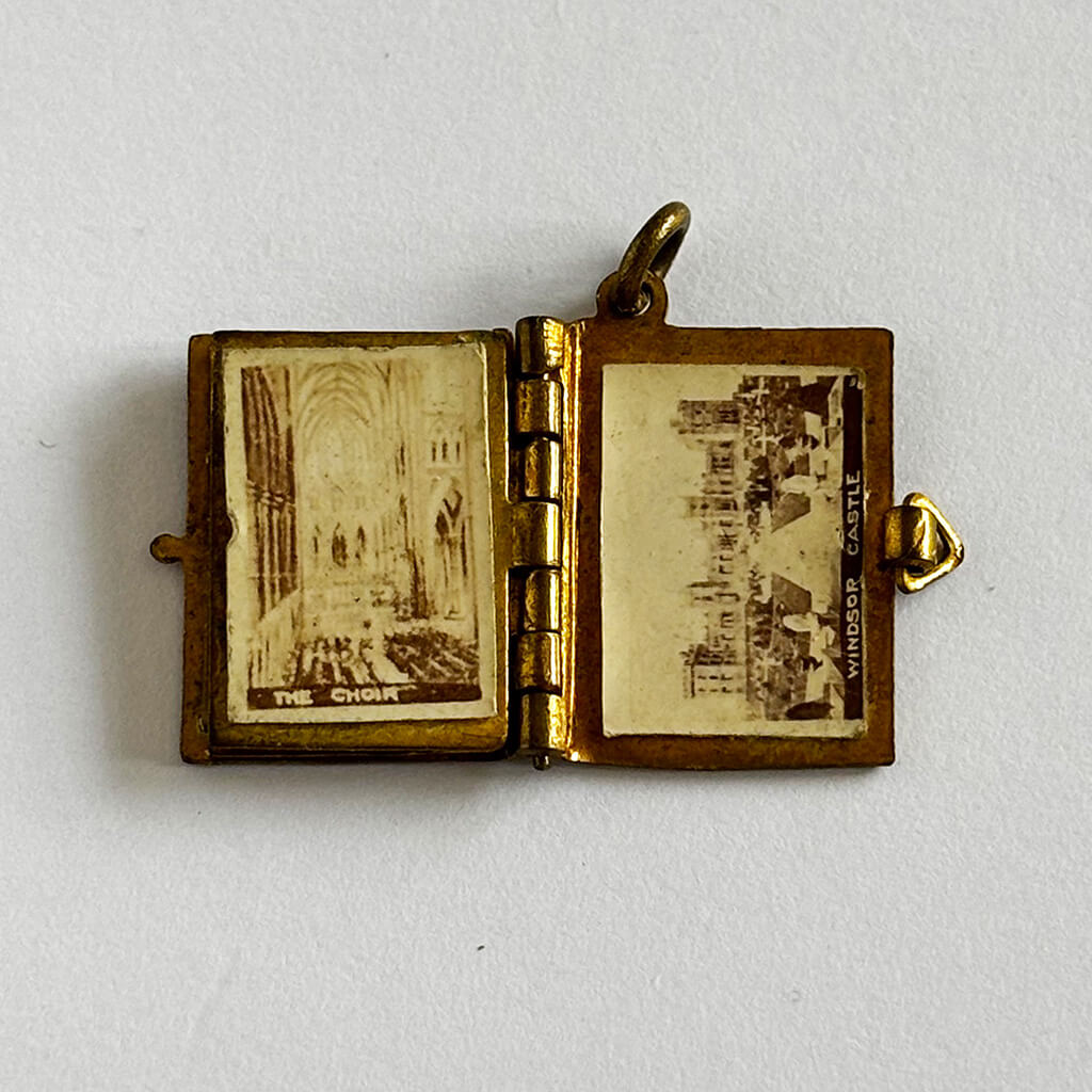 1902 Coronation photo album charm open to Windsor Castle on white background