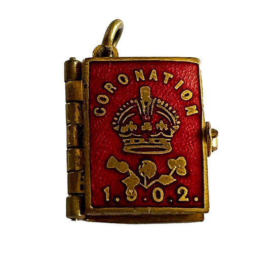 1902 Coronation photo album charm with red enamel cover on white background