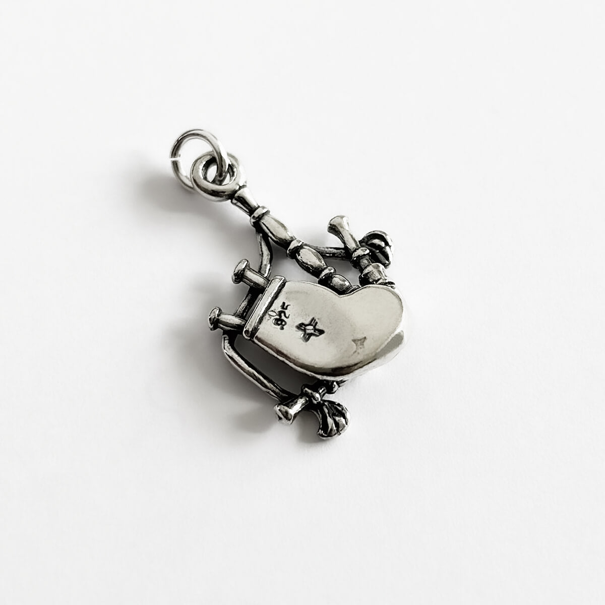 Sterling silver 3D Scottish bagpipes charm from Charmarama on a white background