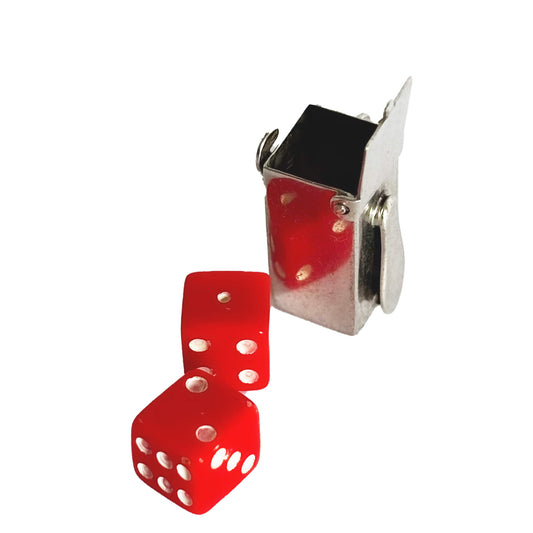 Two red dice with sterling silver box charm on a white background