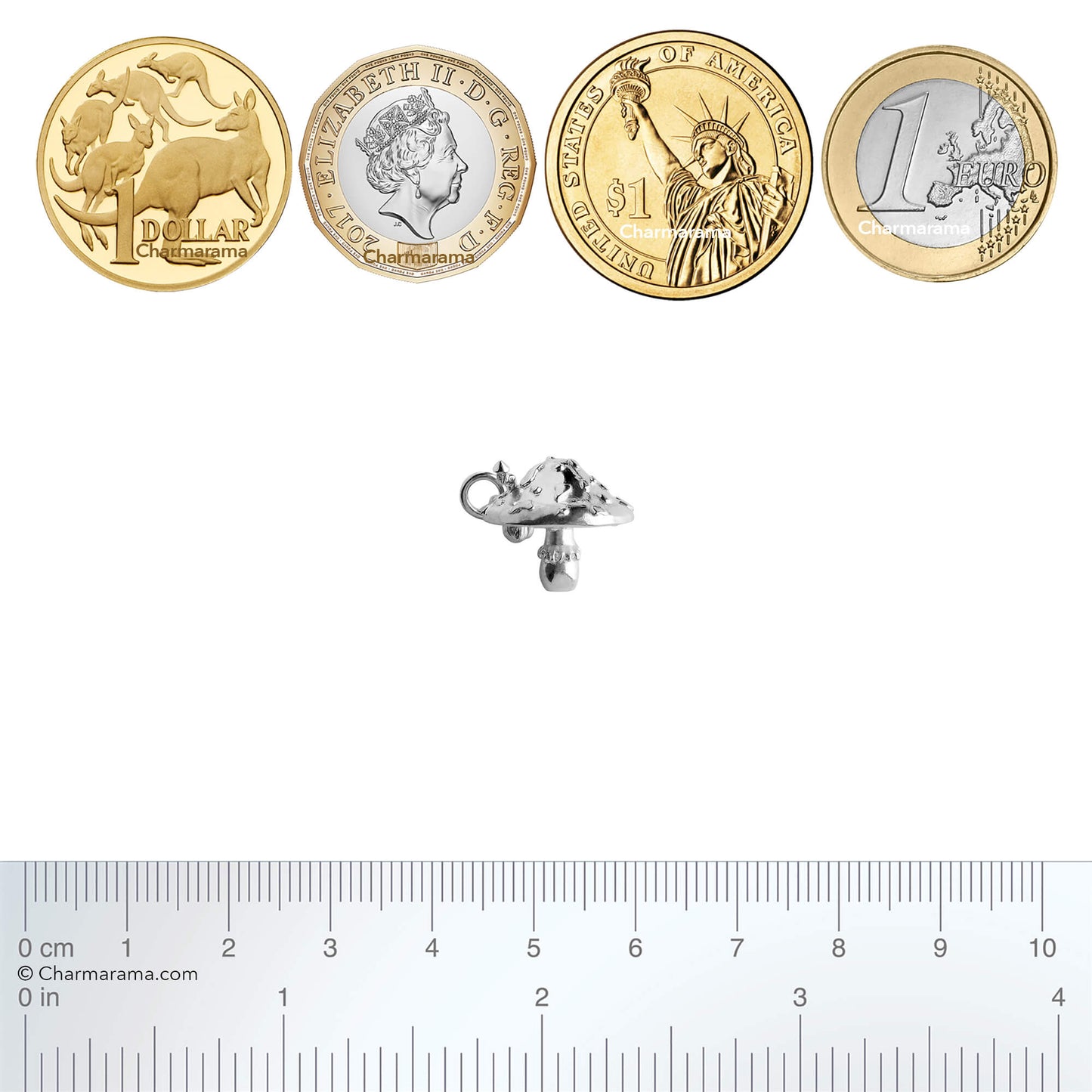 Sterling silver toadstool charm with coins and ruler for scale on a white background
