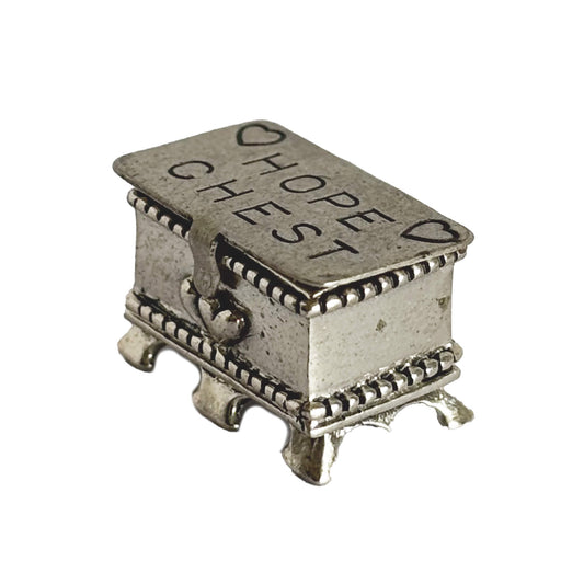 Sterling silver hope chest charm on a white background