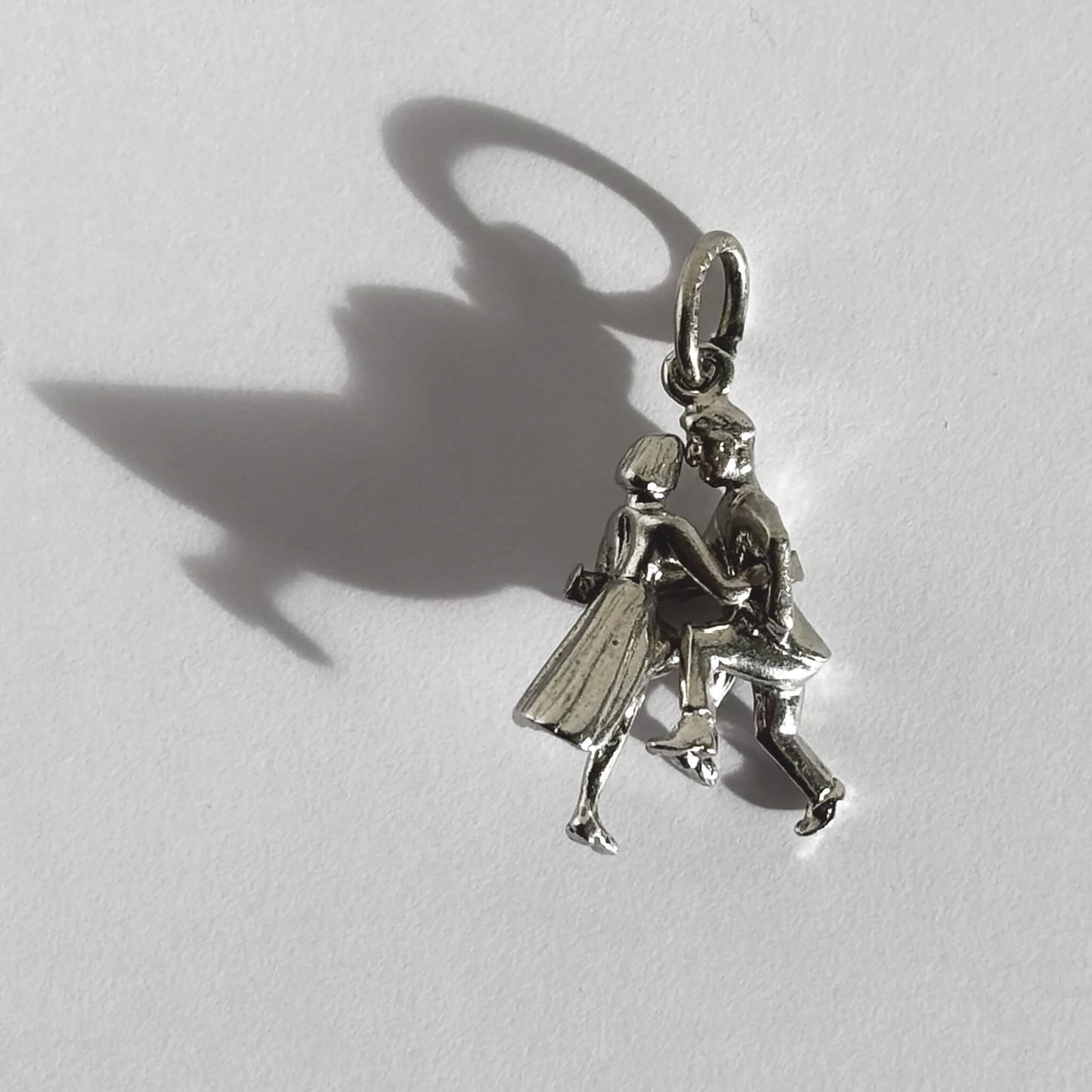 Sterling silver jitterbug jive dancers charm on grey background