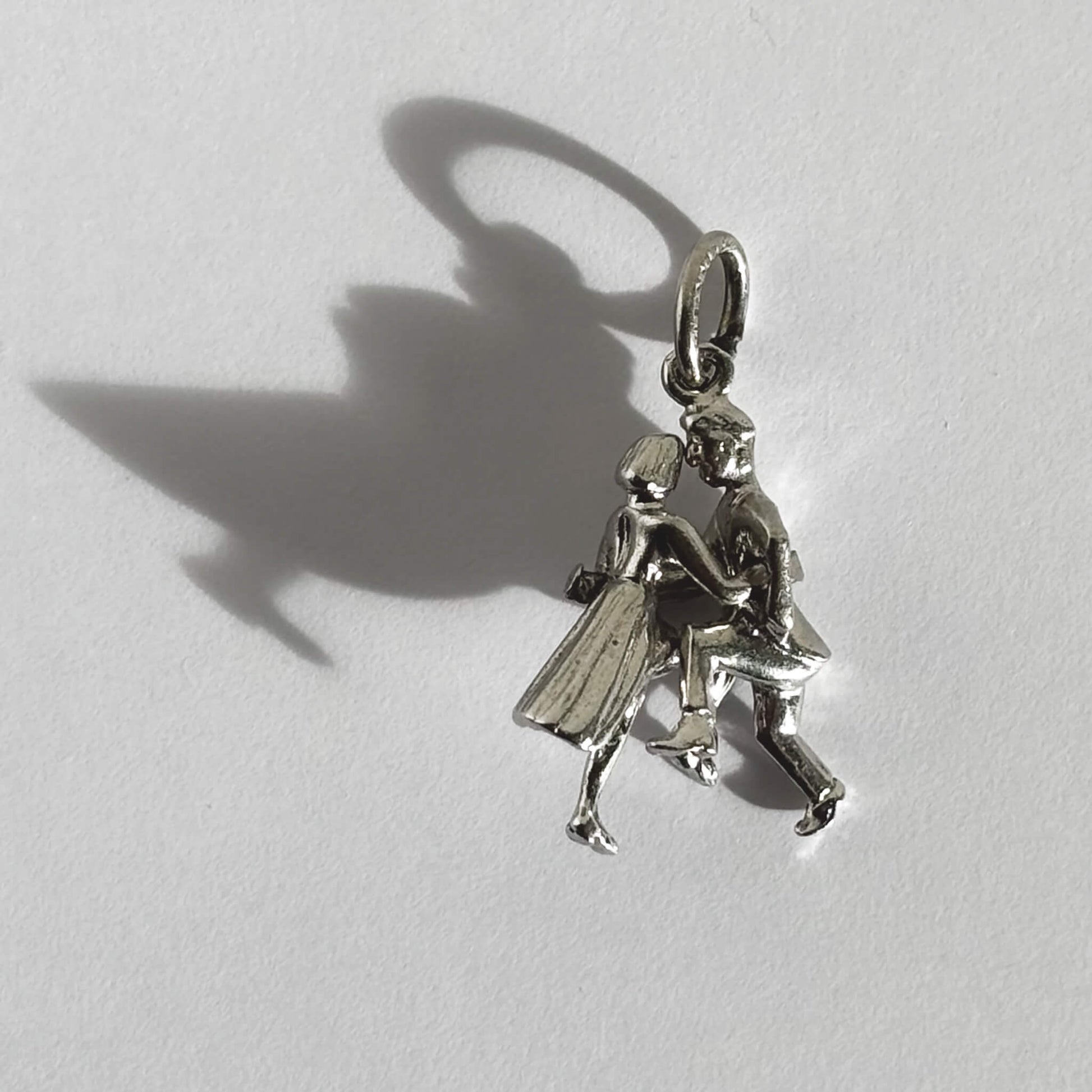 Sterling silver jitterbug jive dancers charm on grey background